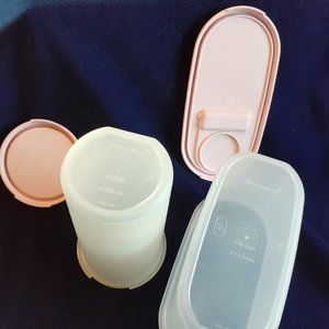 - - Tupperware modular mates. 1 round and 1 oblong with seals